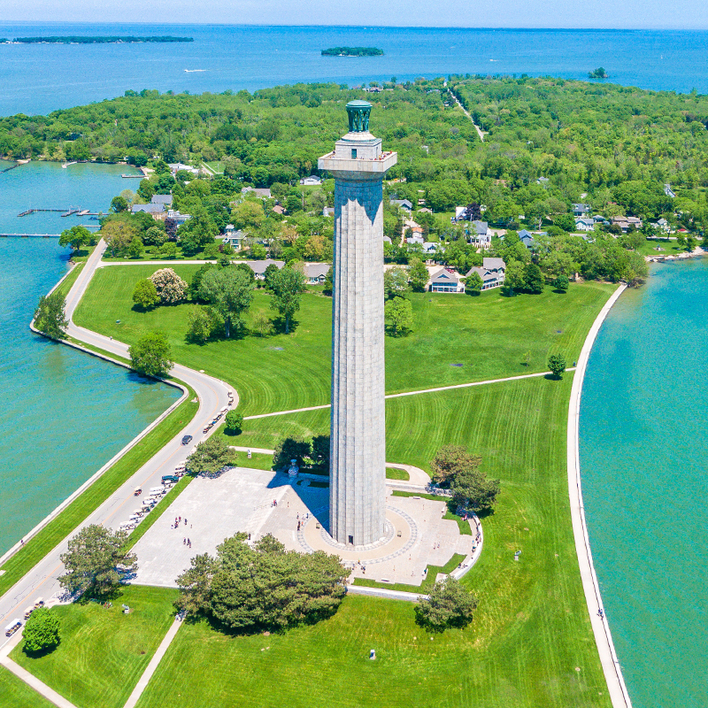 Aerial view of Put in Bay's marina & Perry's Victory & International Peace Memorial, Kelley's Island in the far background; Put-in-Bay, South Bass island Ohio USA